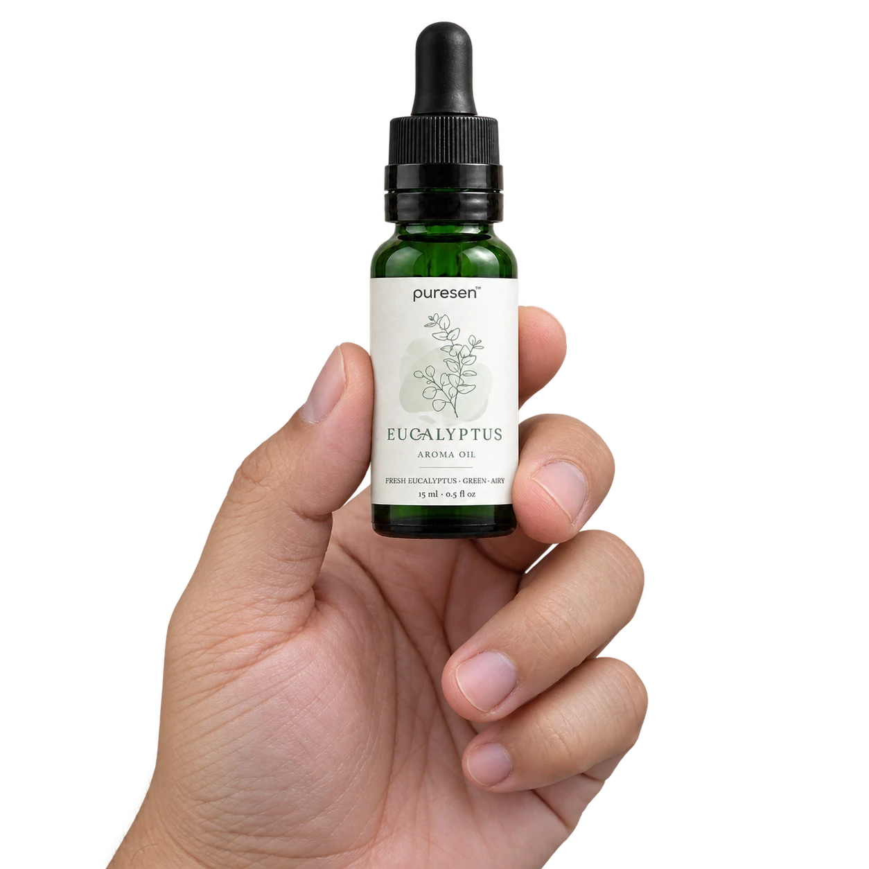 Puresen Eucalyptus 15 ml Aroma Oil held naturally between the fingers of an adult hand