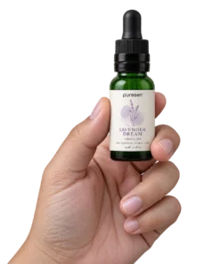 Puresen Lavender Dream 15 ml Aroma Oil held naturally between the fingers of an adult hand