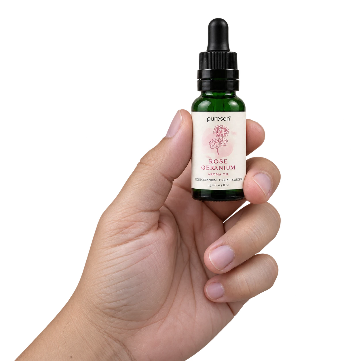 Puresen Rose Geranium 15 ml Aroma Oil held naturally between the fingers of an adult hand