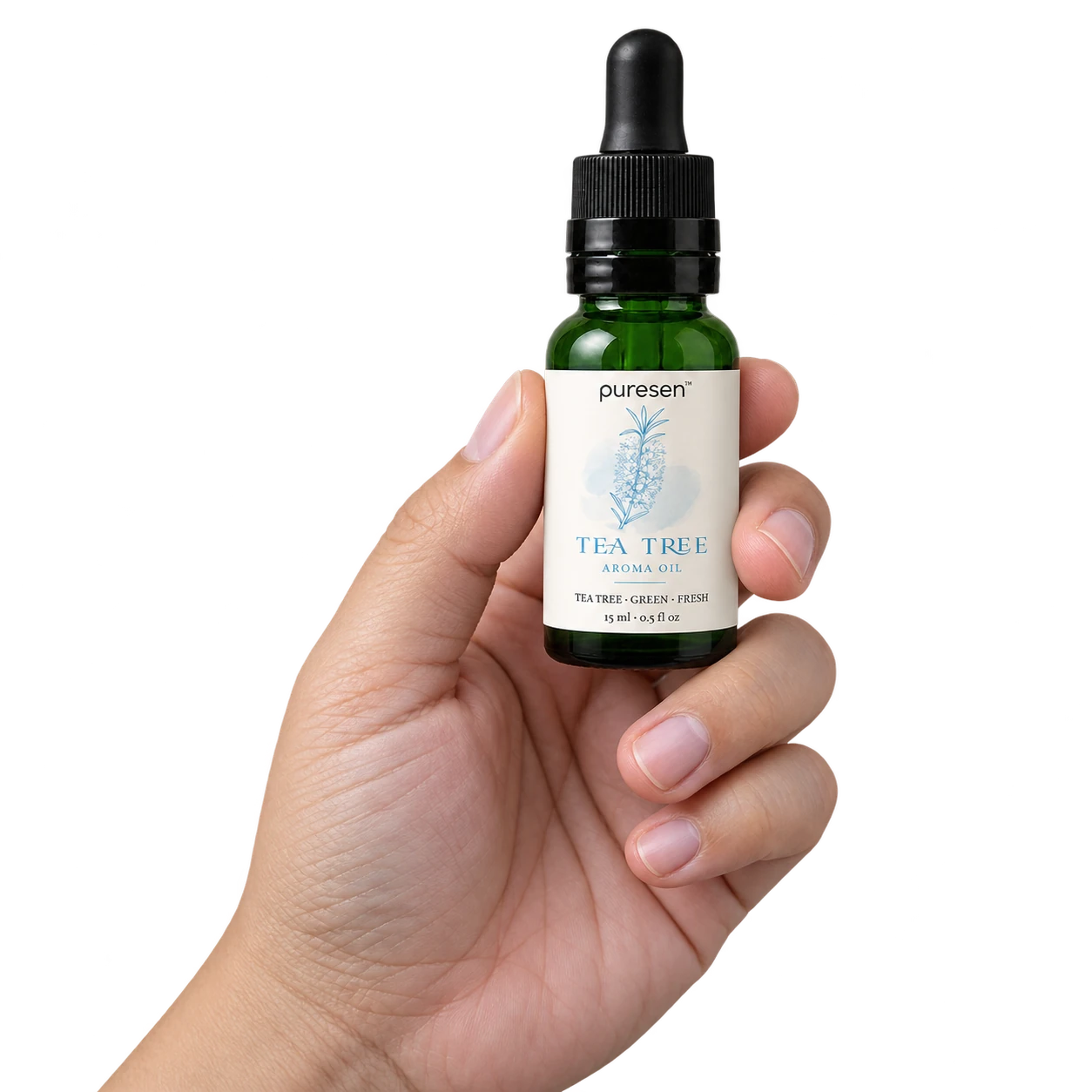 Puresen Tea Tree 15 ml Aroma Oil held naturally between the fingers of an adult hand